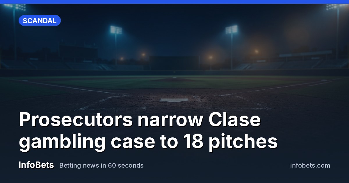 A baseball pitcher mid-windup on the mound during a night game.