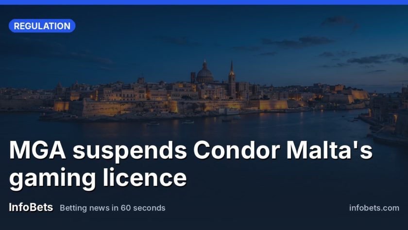 The walled city of Valletta at dusk seen across the Grand Harbour, the bastions lit amber, the water calm