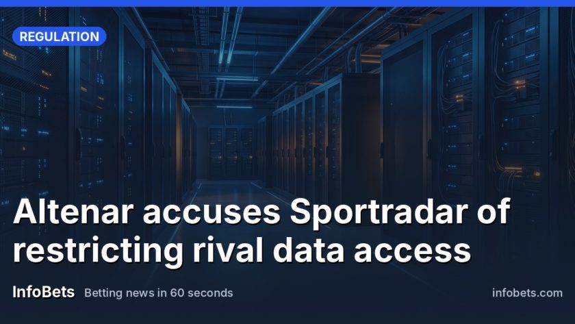 An empty data centre corridor lined with server racks under cool blue light.