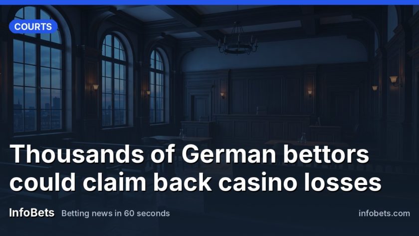An empty German courtroom with tall windows & dark wood panelling at dusk.