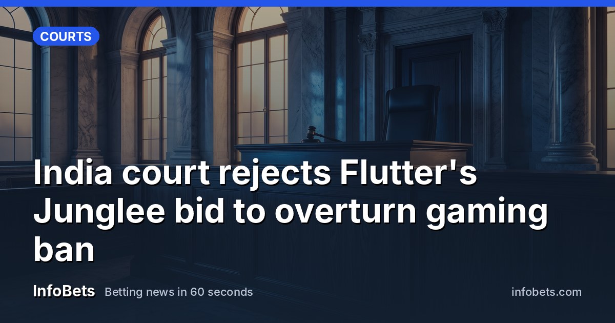 An empty courtroom bench in grand marble surroundings, lit by soft afternoon light through tall windows.