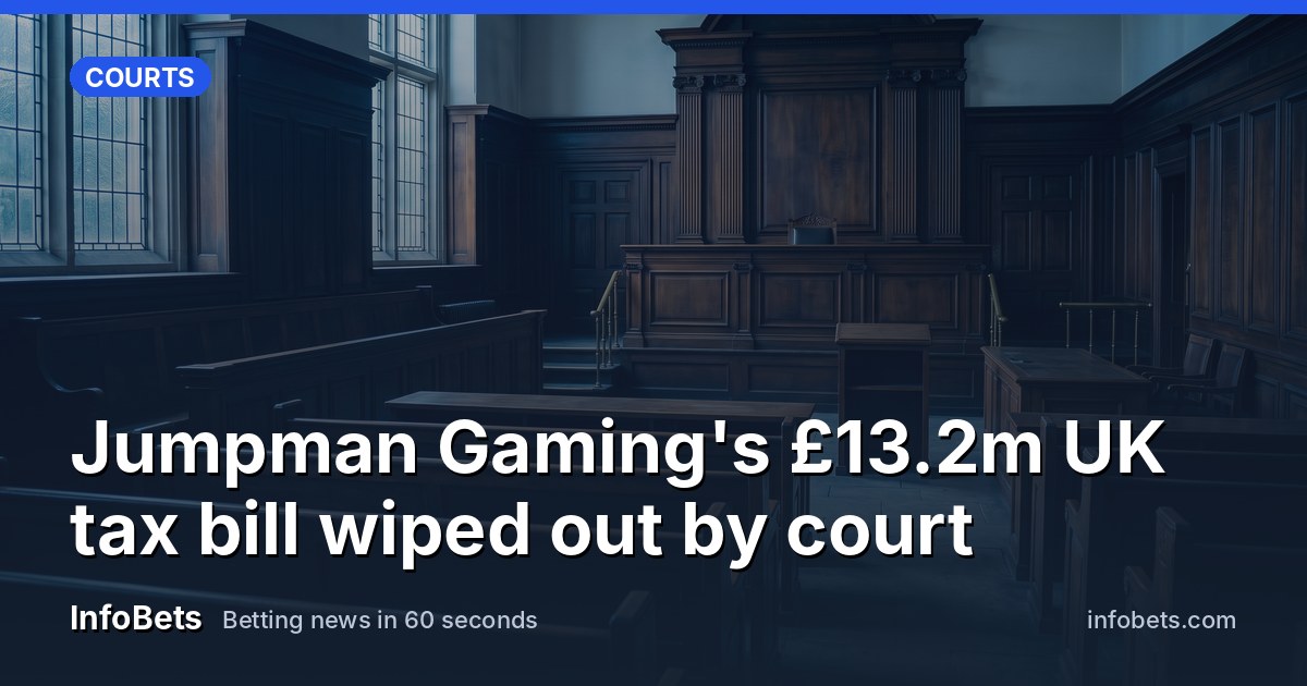 An empty courtroom with wood panelling & an unmarked judge's bench lit by soft daylight.