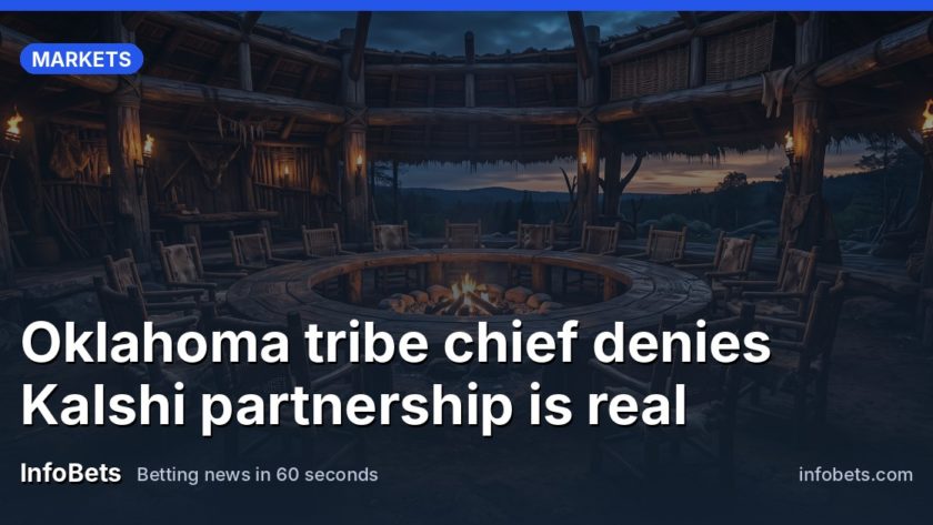 An empty tribal council chamber at dusk with vacant seats around a wooden table, no papers or signage visible.