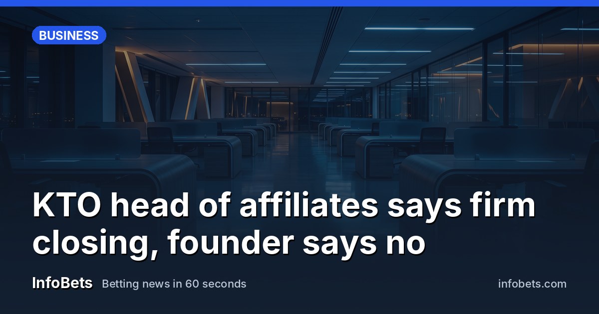 An empty corporate office floor at dusk with rows of vacant desks & no screens or paperwork visible.