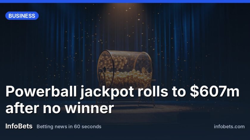 An empty stage under a warm spotlight holds a glass drum of glowing plain gold balls turning slowly, with drifting gold confetti catching the light against a dark velvet backdrop.