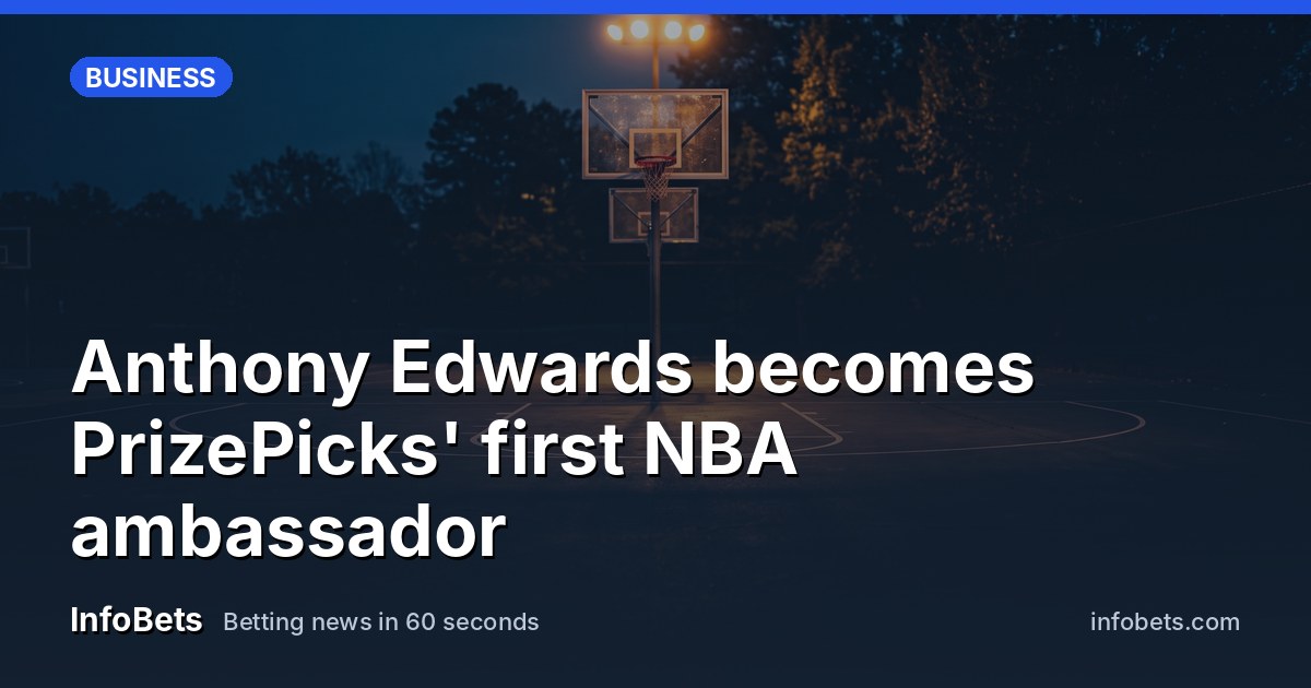 An empty Atlanta basketball court at dusk with warm stadium lights glowing over the hoop.