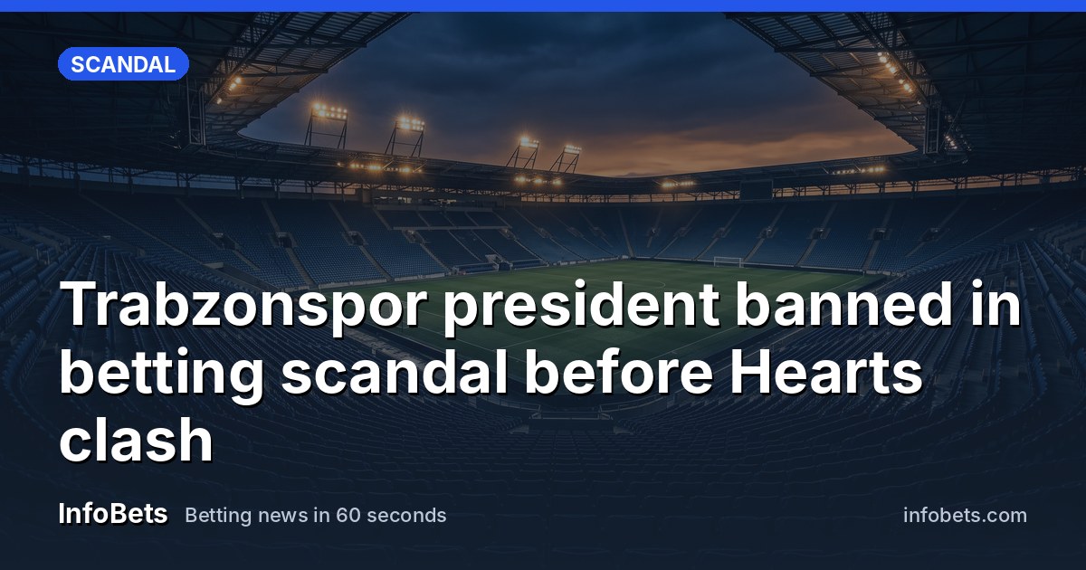 An empty floodlit football stadium at dusk with rows of vacant seats.